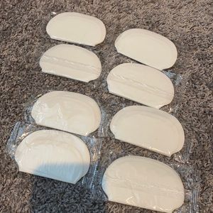 White underarm shields.